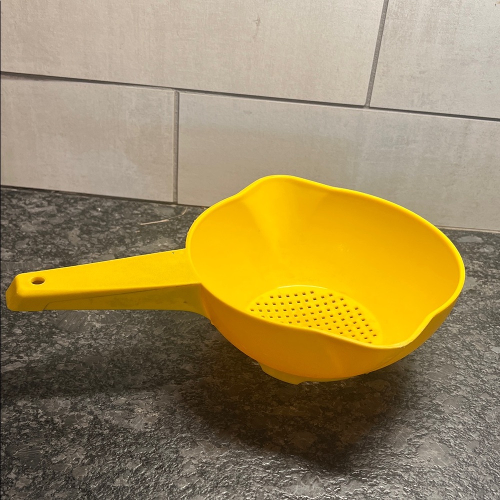 Vintage 8” Bright Yellow Strainer with Handle by Tupperware.  Good condition